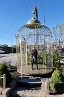 Janet testing out the giant birdcage, Casey, Illinois
