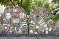 Bricolage fence, two panels, one with American flag