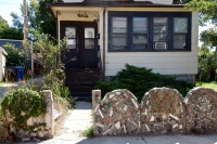 Bricolage fence, entry and house