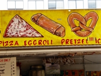 Pizza, eggroll, pretzel. Vernacular hand-painted food truck signage, National Mall, Washington, D.C.