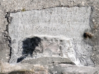 Rock seat with added hands, Reyna, 8-6 1958. Chicago lakefront stone carvings, between Foster Avenue and Montrose. 2023