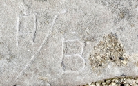 A/B and an upside-down heart. Chicago lakefront stone carvings, between Foster Avenue and Montrose. 2017