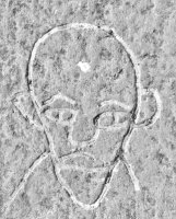 Pointy-chinned face. Chicago lakefront stone carvings, between Foster Avenue and Montrose. Before 2003 Pointy-chinned face. Chicago lakefront stone carvings, between Foster Avenue and Montrose. Before 2003