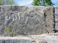 Small screaming face. Level 3, vertical. Chicago lakefront stone carvings, between Foster Avenue and Montrose. 2018