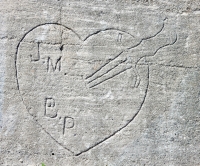 J.M. B.P. with knife. Vertical. Chicago lakefront stone carvings, between Foster Avenue and Montrose. 2017 J.M. B.P. with knife. Vertical. Chicago lakefront stone carvings, between Foster Avenue and Montrose. 2017