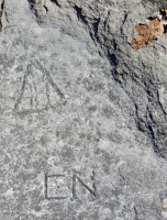 Sailboat, or triangle containing AHA, CN, level 1. Chicago lakefront stone carvings, between Foster Avenue and Montrose. 2017 Sailboat, or triangle containing AHA, CN, level 1. Chicago lakefront stone carvings, between Foster Avenue and Montrose. 2017