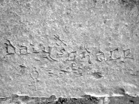 Davy's Grace, 84, with arrow and symbols. Chicago lakefront stone carvings, between Foster Avenue and Montrose. 2007