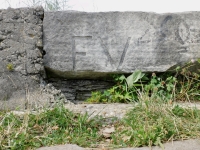 EV, vertical. Chicago lakefront stone carvings, between Foster Avenue and Montrose. 2022 EV, vertical. Chicago lakefront stone carvings, between Foster Avenue and Montrose. 2022