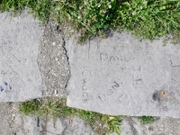 Autograph rock: Chuck, Don, Dave and others, OF. Chicago lakefront stone carvings, between Foster Avenue and Montrose. 2023