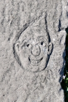 Pointy-topped face, detail. Chicago lakefront stone carvings, between Foster Avenue and Montrose. 2021 Pointy-topped face, detail. Chicago lakefront stone carvings, between Foster Avenue and Montrose. 2021