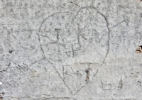 J.K. Love R.T. in heart with arrow 64, level 2. Chicago lakefront stone carvings, between Foster Avenue and Montrose. 2017 J.K. Love R.T. in heart with arrow 64, level 2. Chicago lakefront stone carvings, between Foster Avenue and Montrose. 2017