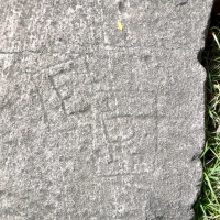 EP, detail, upper left of RB, J.J. block. Chicago lakefront stone carvings, between Foster Avenue and Montrose. 2023