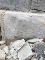 Face, level 1, vertical. Chicago lakefront stone carvings,  Foster Avenue Beach. 2019