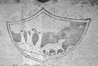 A wolf in the woods and Fides Et Audax (faithful and bold), motto of the 134th Artillery Regiment. The regiment was formed as a unit of the Ohio National Guard in 1839 and still exists. Chicago lakefront stone carvings, between Foster Avenue and Bryn Mawr. This picture is from 1998, when the carving was relatively new