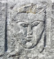 Formerly gold-capped face. Now looks like Elvis. Chicago lakefront stone carvings, between Foster Avenue and Bryn Mawr. 2017 Formerly gold-capped face. Now looks like Elvis. Chicago lakefront stone carvings, between Foster Avenue and Bryn Mawr. 2017