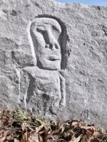 Three enigmatic figures, Easter Island style, detail, near the Hair Washers. Signed RS 08. Chicago lakefront stone carvings at Fullerton. 2024