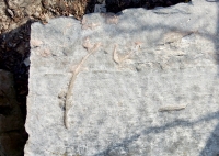 yv, atop triangle-bodied figure. Chicago lakefront stone carvings, Fullerton Avenue and the Lake. 2019