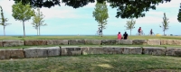 Reconstituted seating area next to the Theater on the Lake, with two hair-washing figures (left) and three Egyptian figures (right). Chicago lakefront stone carvings at Fullerton. 2016