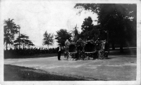 Man posing with large stone crown, snapshot