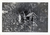 Two women at a water wheel snapshot