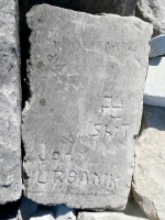 Pip, left-facing swastika, Shit, John Urbanik, Al. Lakefront stone carvings, Veterans Memorial Park (former site of the Stateline power plant), Hammond, Indiana. 2024