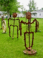 A pair of robots? aliens? in the grass A pair of robots? aliens? in the grass