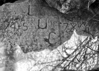 Lucky, 74-S, 78-9. Chicago lakefront stone carvings, 57th Street Beach. 2018