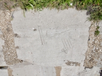 P.H., J, lines. Chicago lakefront stone carvings, south end of 63rd Street Beach. 2018