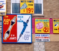 Signs at Julio's Auto Parts, Diversey at Sacramento (2002)-Roadside Art