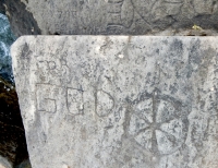 For God, symbol. Chicago lakefront stone carvings, behind La Rabida Hospital, 65th Street and the Lake. 2018