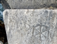For God, symbol. Chicago lakefront stone carvings, behind La Rabida Hospital, 65th Street and the Lake. 2018 For God, symbol. Chicago lakefront stone carvings, behind La Rabida Hospital, 65th Street and the Lake. 2018
