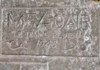 M.F. Adair, Le Temps Reviem, 1948. "Le Temps Revient" was Lorenzo de' Medici's motto, meaning something like "the time comes again." It appears to be misspelled here. Chicago Lakefront stone carvings, south of La Rabida Hospital. 2023