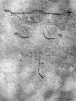 Abstract image, possibly representing a person. The word appears to be "Teen." Chicago lakefront stone carvings, behind La Rabida Hospital, 65th Street and the Lake. 2018 Abstract image, possibly representing a person. The word appears to be "Teen." Chicago lakefront stone carvings, behind La Rabida Hospital, 65th Street and the Lake. 2018