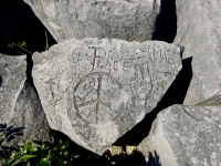 Peace rock: peace symbol, peace sign, footprint, butterfly, flowers, Leo, Kris, Pat, Audrey, Mark, Larry. Chicago lakefront stone carvings, behind La Rabida Hospital, 65th Street and the Lake. 2018 Peace rock: peace symbol, peace sign, footprint, butterfly, flowers, Leo, Kris, Pat, Audrey, Mark, Larry. Chicago lakefront stone carvings, behind La Rabida Hospital, 65th Street and the Lake. 2018