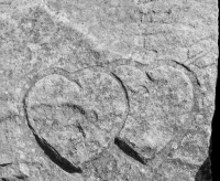 Twin hearts with arrow, detail. Chicago lakefront stone carvings, behind La Rabida Hospital, 65th Street and the Lake. 2018 Twin hearts with arrow, detail. Chicago lakefront stone carvings, behind La Rabida Hospital, 65th Street and the Lake. 2018
