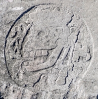 Mayan skull, based on reliefs in the Great Ball Court in Chichen Itza. Chicago lakefront stone carvings, Foster Avenue Beach. 2021