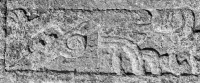 Mayan bird deity with a hummingbird and large Xs, detail. Signed "595PT/JUH," September 1995. Based on a panel from the Temple of the Foliated Cross in the Maya archaeological site at Palenque. Chicago lakefront stone carvings between Foster Avenue and Bryn Mawr. 2013