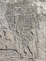 Mesoamerican scene with reclining and stranding figures, detail. Chicago lakefront stone carvings between Foster Avenue and Bryn Mawr. 2013