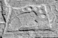 Mesoamerican figure, with shoes and fish, signed UJH, September 1996, fish detail. Chicago lakefront stone carvings between Foster Avenue and Bryn Mawr. 2013 Mesoamerican figure, with shoes and fish, signed UJH, September 1996, fish detail. Chicago lakefront stone carvings between Foster Avenue and Bryn Mawr. 2013