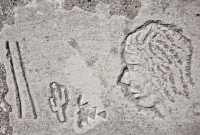 Profile, cactus and symbols. Chicago lakefront stone carvings, south of Montrose. 2010 Profile, cactus and symbols. Chicago lakefront stone carvings, south of Montrose. 2010