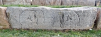 Two kneeling figures. This is one of a group of stones saved during the lakefront reconstruction and placed in newly created park land at Fullerton Avenue and the lake. Most of hte stones, however, are lost. Chicago lakefront stone carvings. 2016