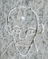 Pointy-chinned face. Chicago lakefront stone carvings, between Foster Avenue and Montrose. Before 2003 Pointy-chinned face. Chicago lakefront stone carvings, between Foster Avenue and Montrose. Before 2003
