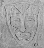 Mask with moon and stars, signed I.V. One of the best of all the lakefront carvings. Chicago lakefront stone carvings, Montrose Beach. Before 2003