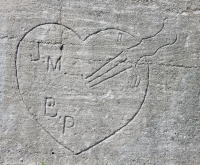 J.M. B.P. with knife. Chicago lakefront stone carvings, between Foster Avenue and Montrose. 2017 J.M. B.P. with knife. Chicago lakefront stone carvings, between Foster Avenue and Montrose. 2017