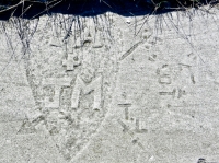 LA + JM. TL. 67. Arrow through heart. Chicago lakefront stone carvings, south of Montrose Harbor. 2013