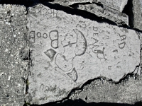Flapper, with names. Chicago lakefront stone carvings, south of Montrose Harbor. 2003