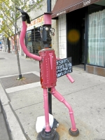 3 Stars Auto Body sidewalk muffler man in November 2011, spruced up with a paint job that adds some nice details. Lawrence Avenue near Sacramento, Chicago