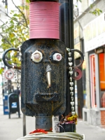 Face detail, 3 Stars Auto Body sidewalk muffler man in November 2011. Lawrence Avenue near Sacramento, Chicago