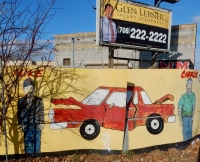 Damaged car and two standing figures. Frank's West Side Auto Parts, Kedzie at 30th Street. I really like the personalizations