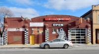 Storefront with Michelin Man painting. Midwest Tires, Pulaski Road and 25th Street